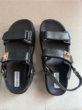Steve Madden Black Leather Sandal with Gold Buckle Accents